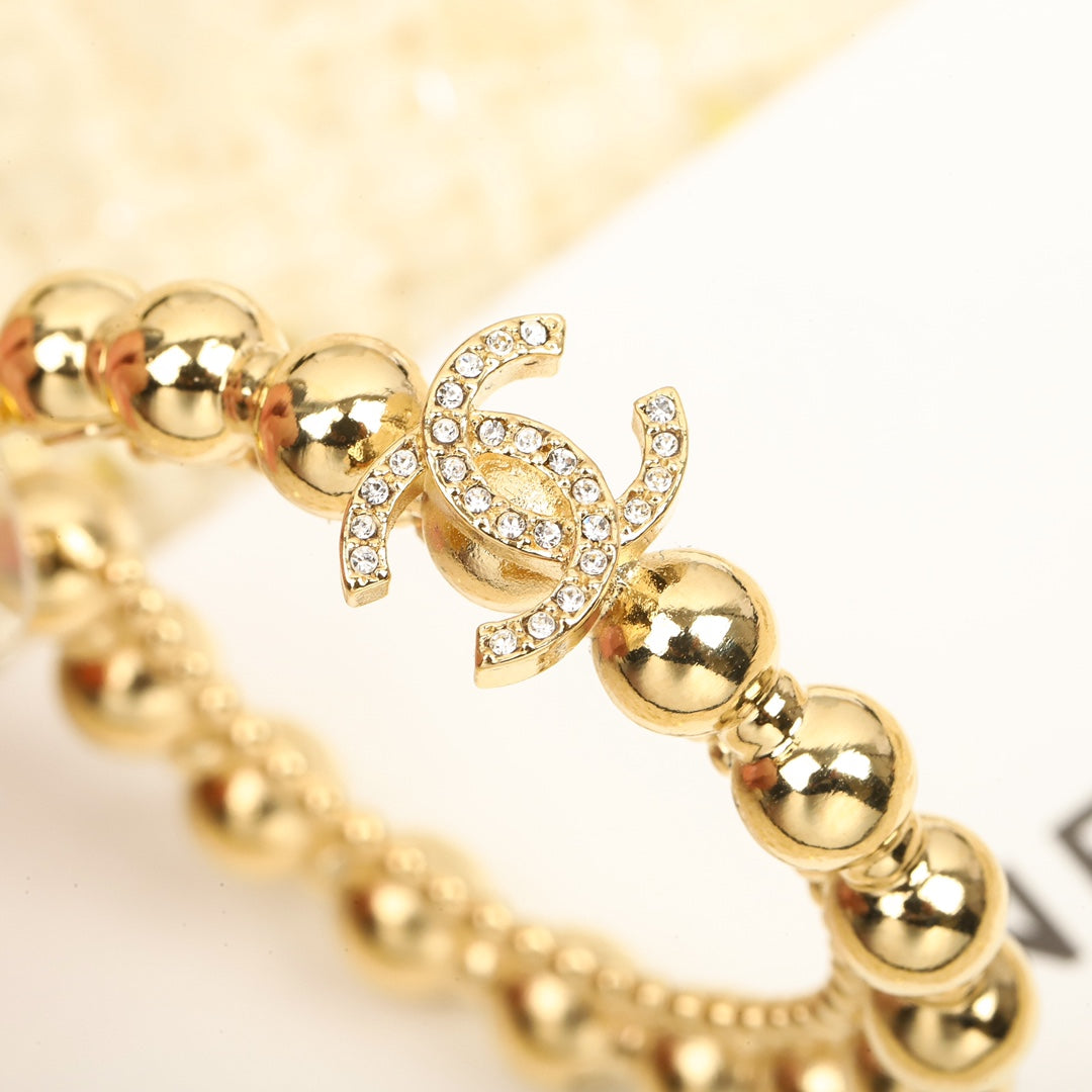 Golden bead double c pearl earrings