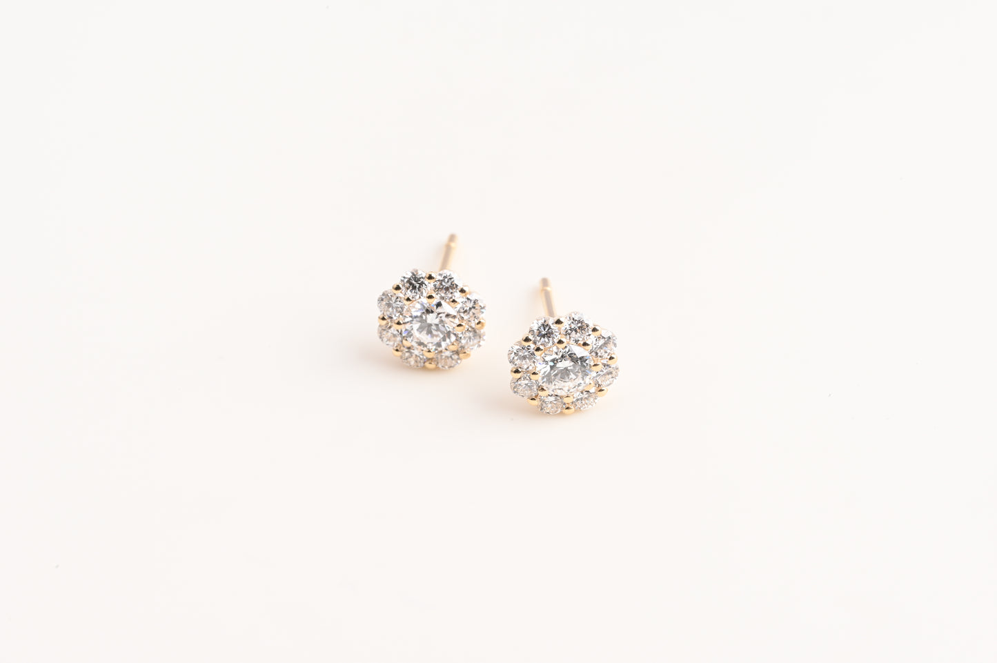 Small trumpet-shaped diamond stud earrings