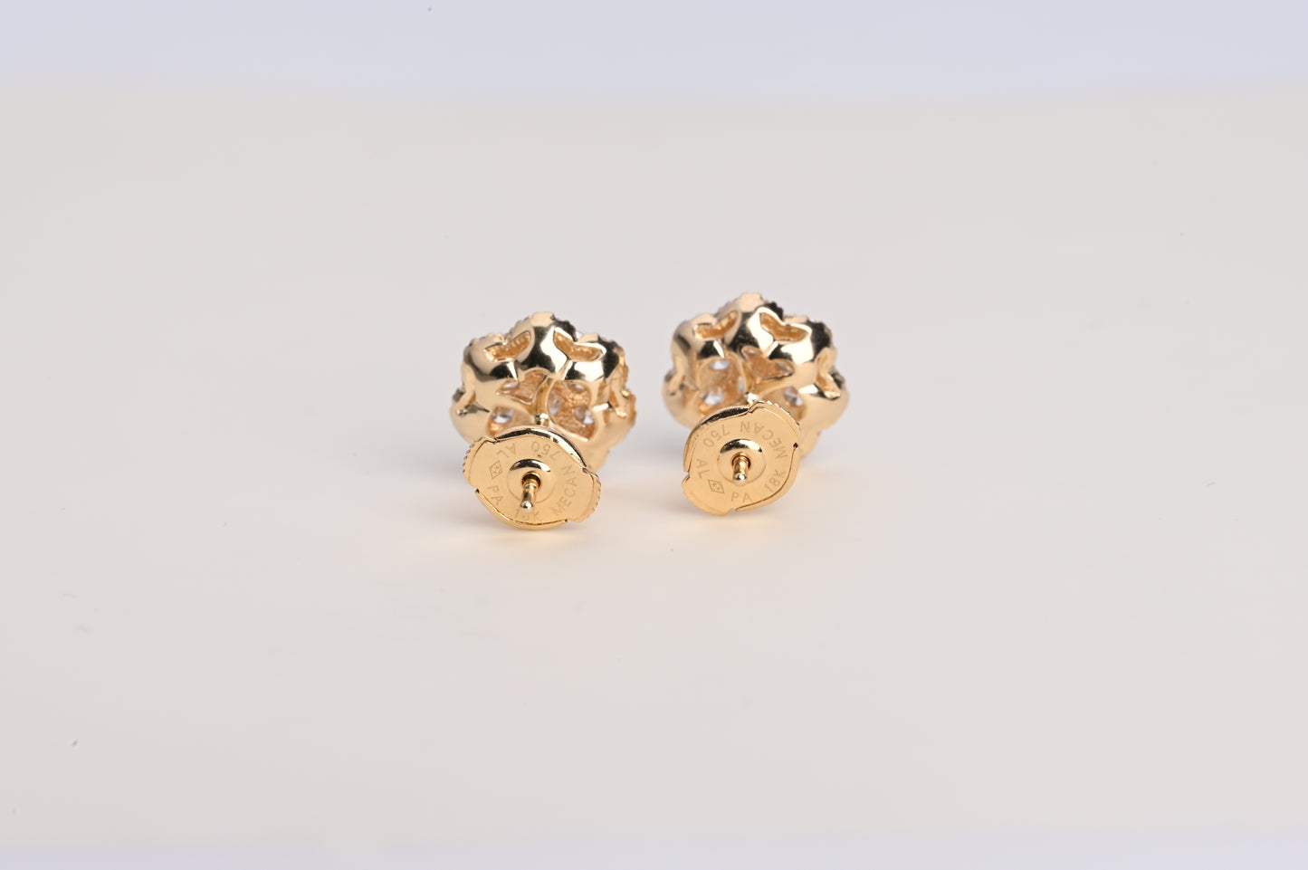 Small trumpet-shaped diamond stud earrings