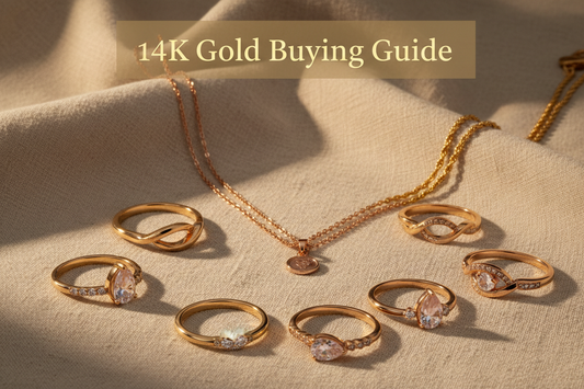 14K gold rings and rose gold jewelry on beige background