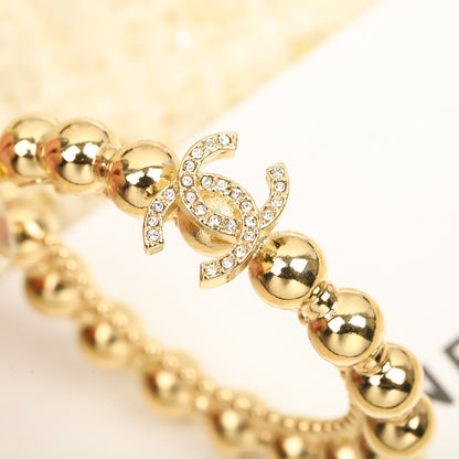 Golden bead double c pearl earrings