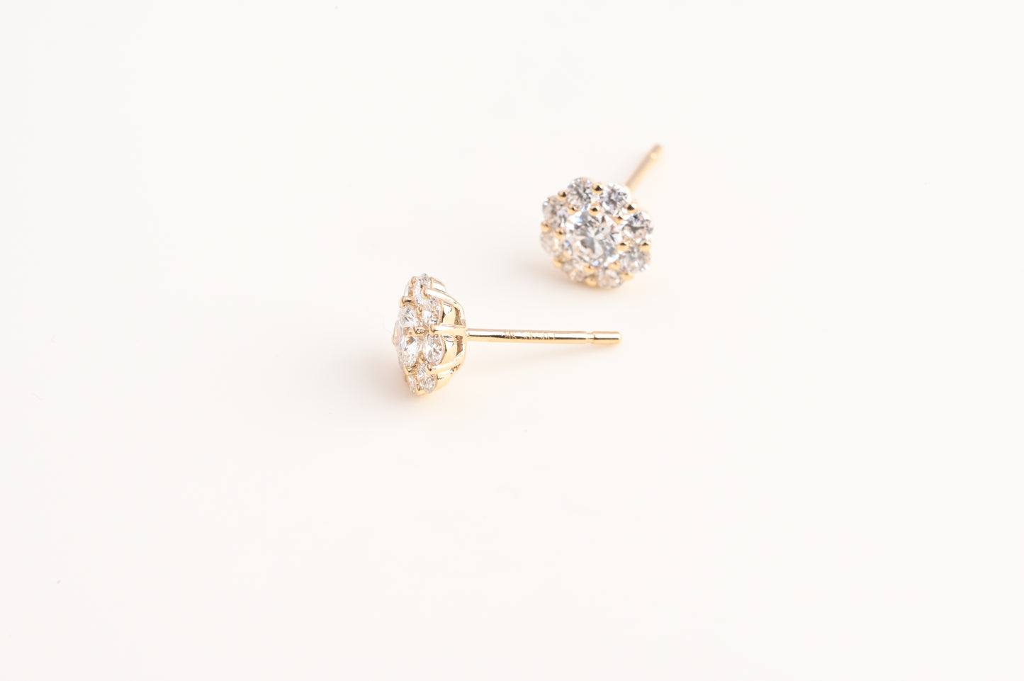 Small trumpet-shaped diamond stud earrings
