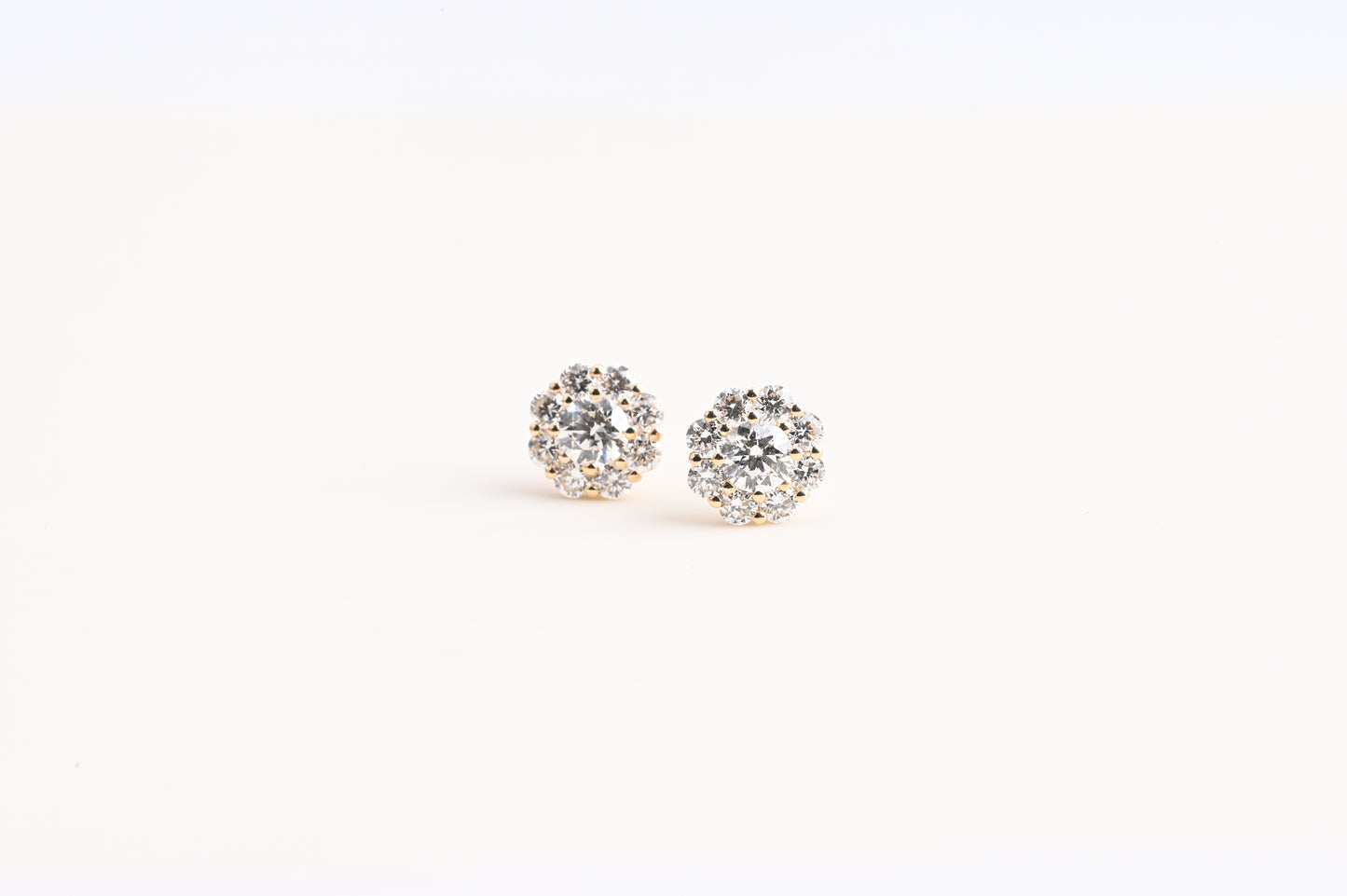 Small trumpet-shaped diamond stud earrings